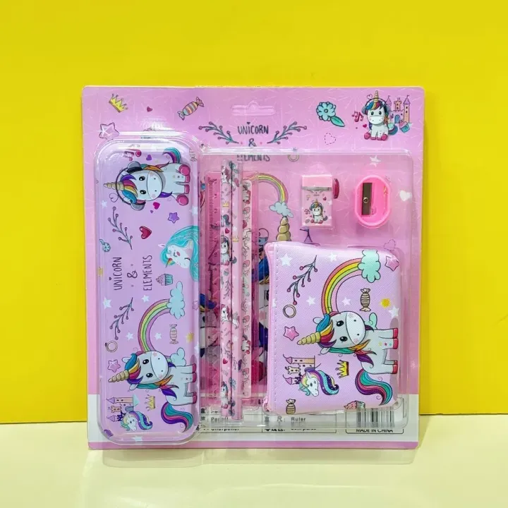 Unicorn-themed stationery set in packaging on a yellow background